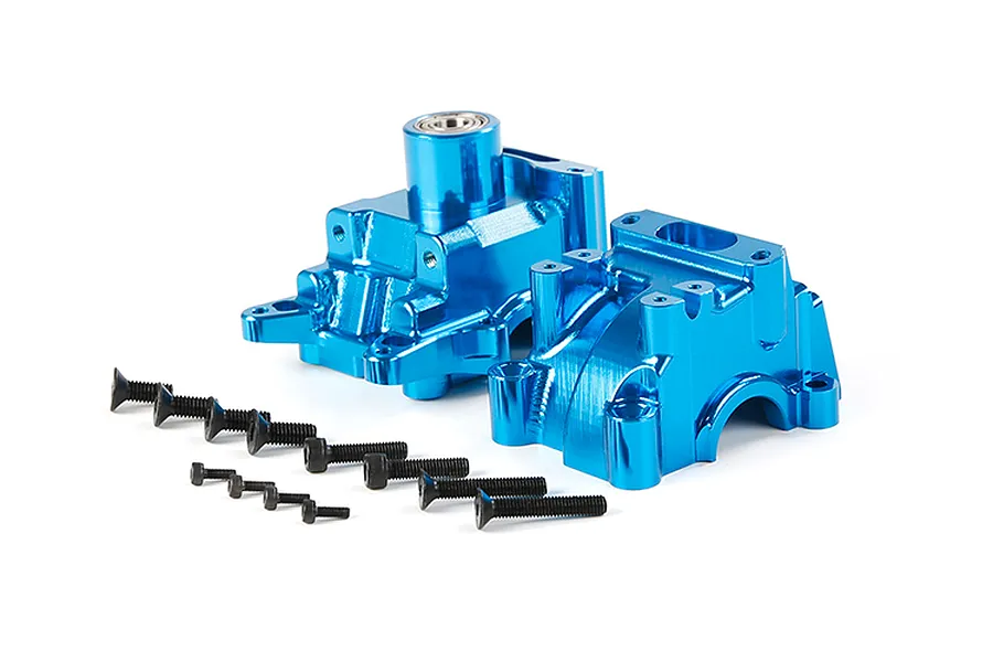 A blue anodized aluminium RC gearbox case set with included black mounting screws on a white background.