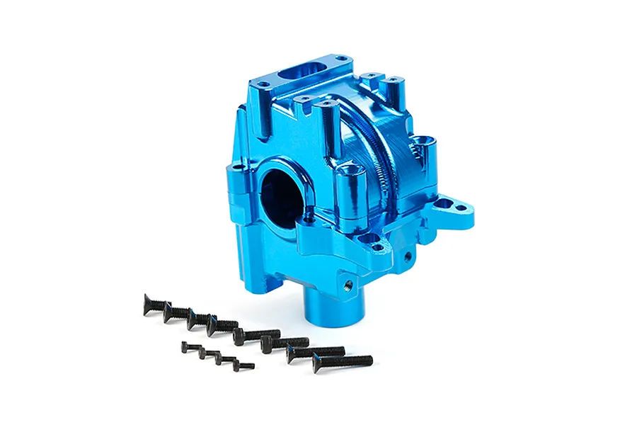 A blue anodized aluminium gearbox case for an RC vehicle, accompanied by several black flat-head screws, isolated on a white background.