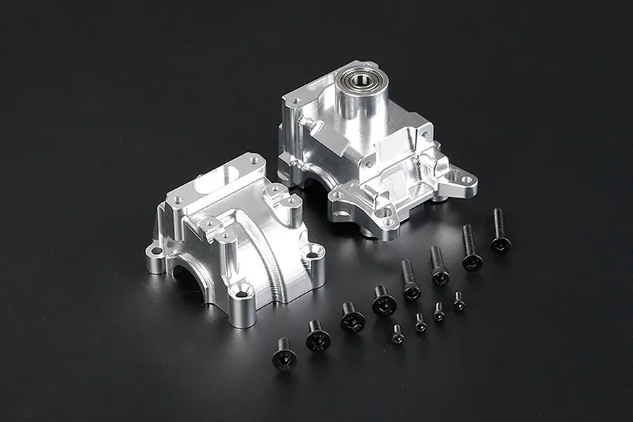 Rovan silver aluminium gearbox case set for RC cars, including two main housing halves and a collection of various black mounting screws.
