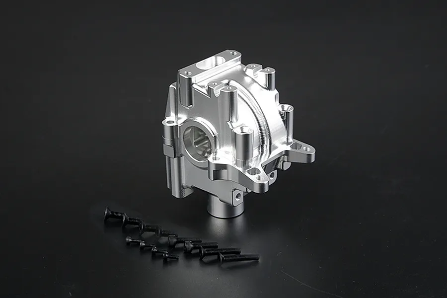 A silver Rovan aluminium gearbox case for an RC car, shown with a set of black mounting screws on a dark background.