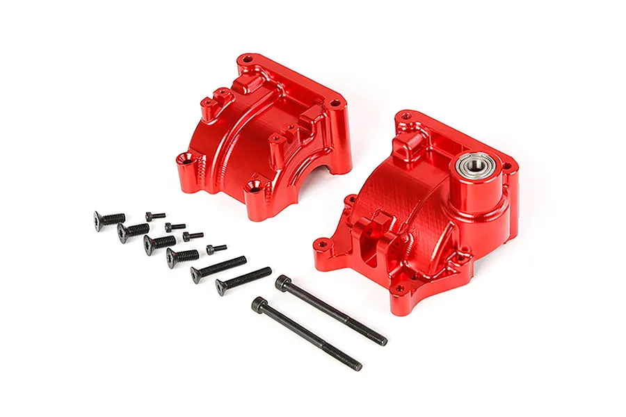 A pair of red anodized aluminium RC gearbox case halves with a set of black mounting screws on a white background.