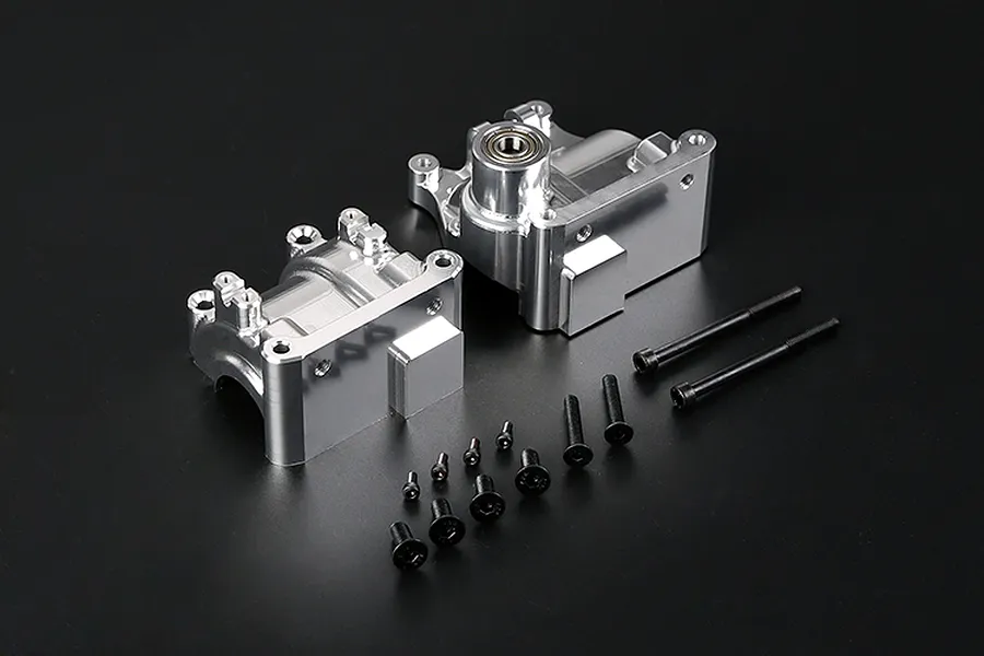 A silver Rovan aluminium gearbox case set for RC cars, including two case halves, a pre-installed bearing, and a collection of black mounting screws.