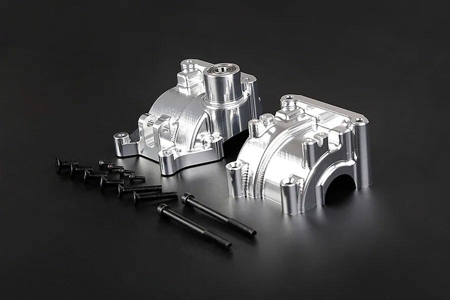 Rovan silver aluminium gearbox case set for RC cars with included black mounting screws on a black background.