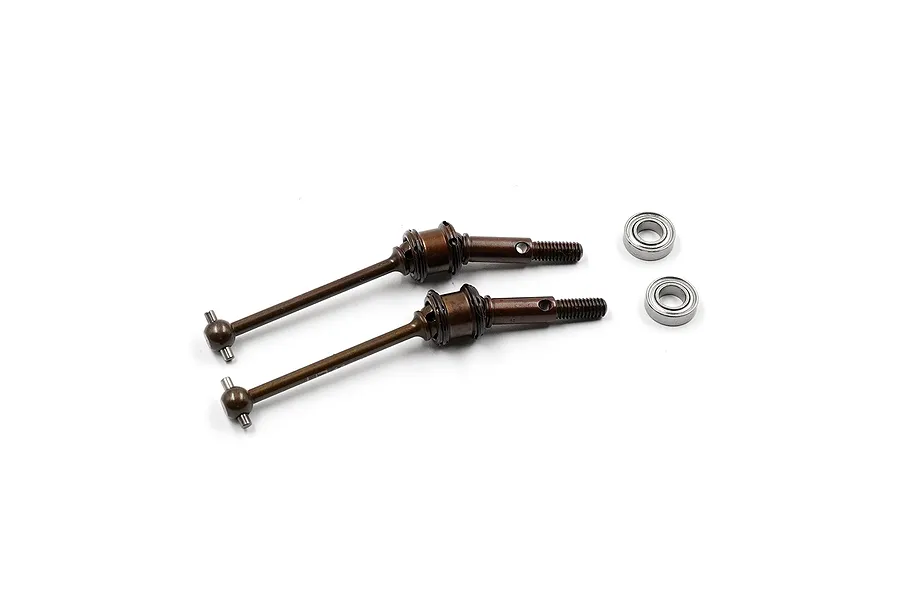 Two brown spring steel double joint driveshafts and two small metal ball bearings on a white background.