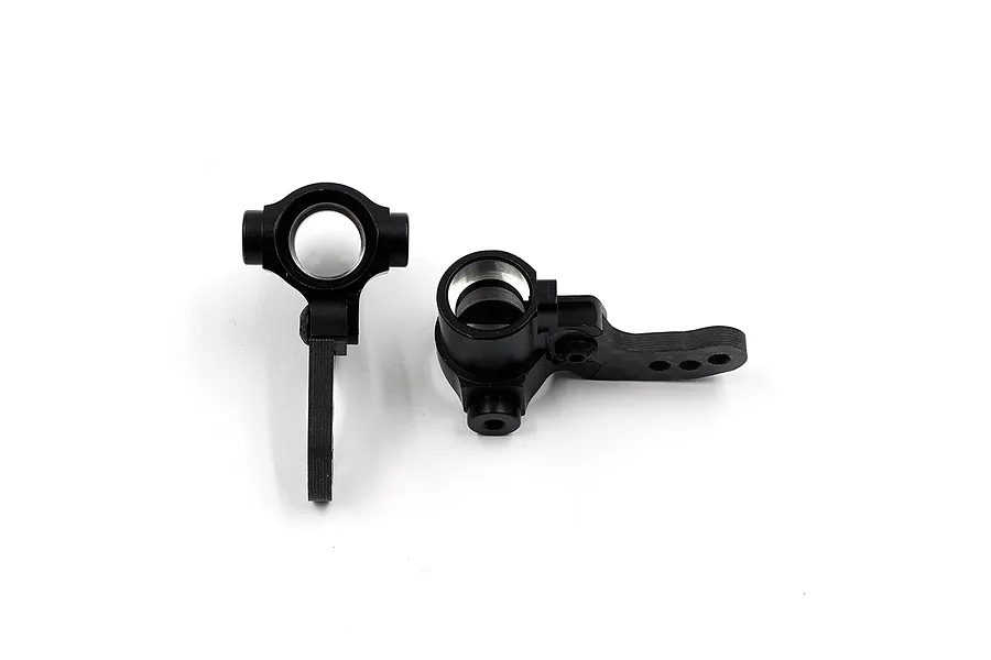Two black RC steering hubs made of aluminium and carbon fibre, shown from different angles against a white background.