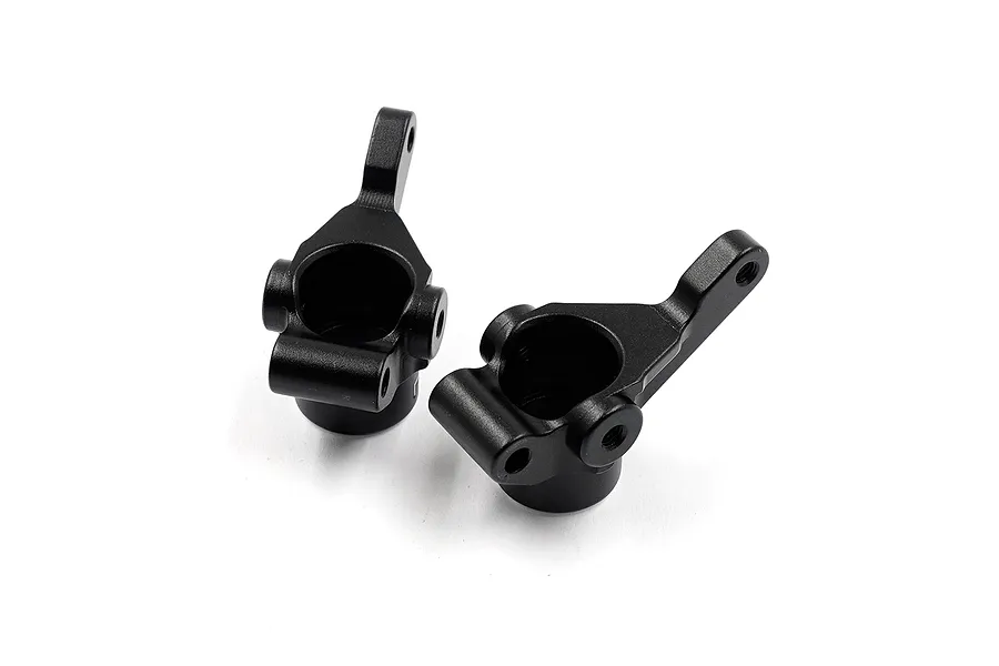Two black aluminium RC car steering knuckles positioned on a white background.