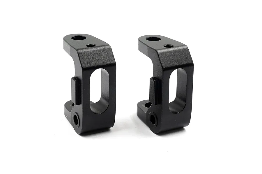 Two black anodized aluminium C-hub front suspension carriers for RC cars on a white background.