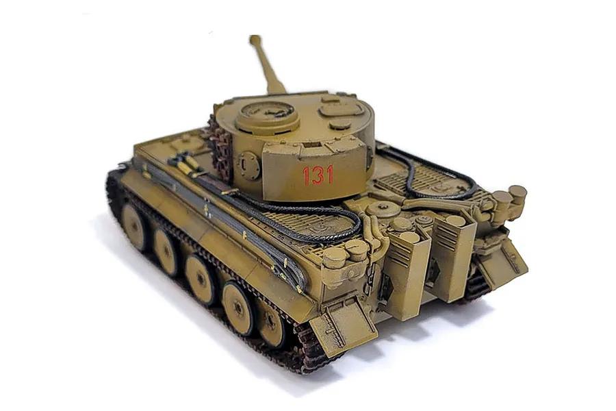 A high-angle view of an assembled and painted 1/72 scale German Tiger I model tank, featuring a tan camouflage scheme and the number 131 on the turret.