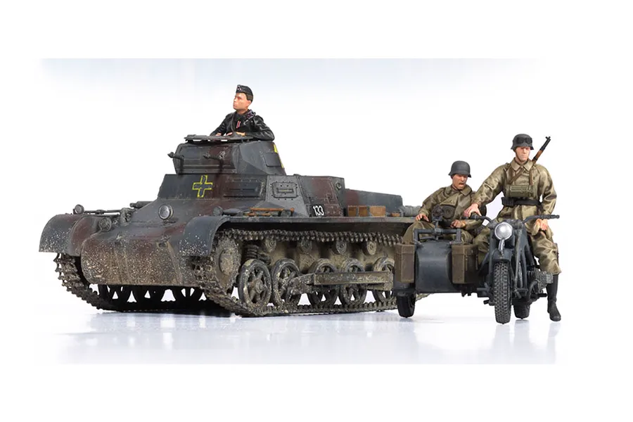 A 1/35 scale model of a German Panzer I Ausf.B tank with a motorcycle and sidecar, featuring painted figures and weathered camouflage paint.