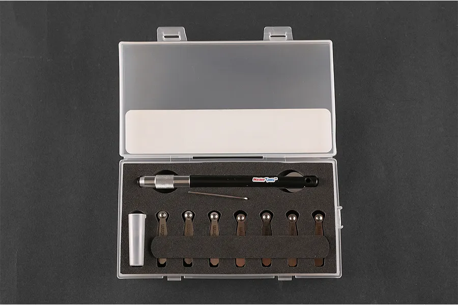 Trumpeter Master Tools rivet maker set in a clear plastic storage case with foam insert, featuring a handle and multiple interchangeable rivet wheels.