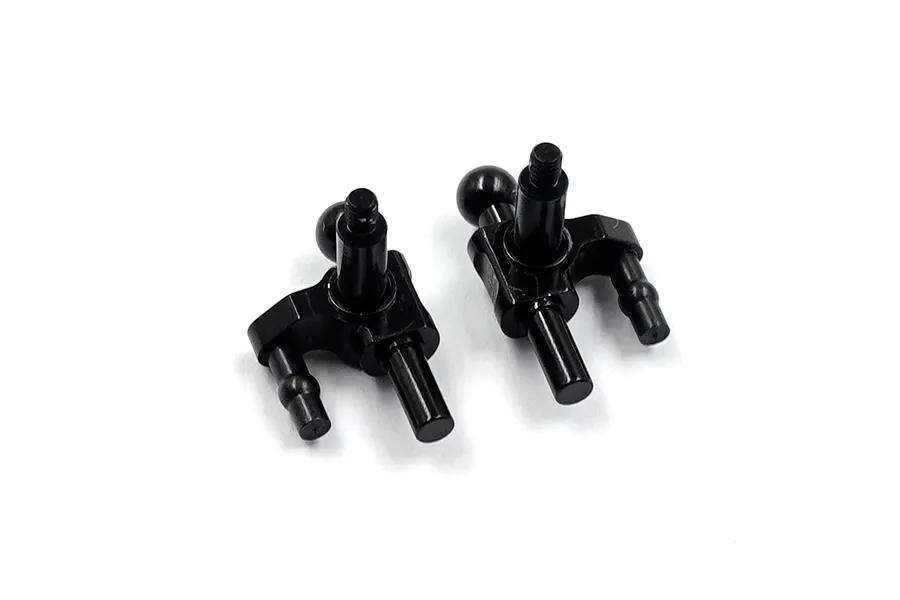 A pair of black aluminium steering knuckles for RC cars against a white background.