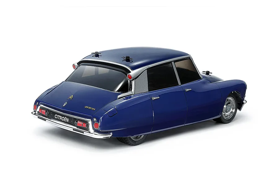 A rear three-quarter view of a blue Tamiya Citroen DS 21 RC car model on a white background.