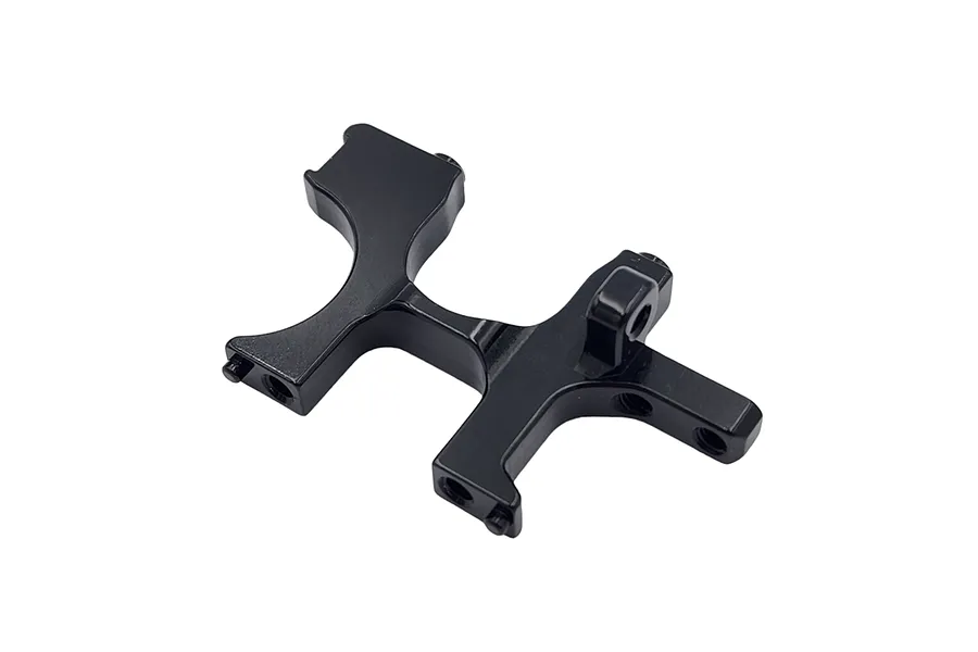 A black anodized aluminum RC car bulkhead part, viewed from an angle against a white background.