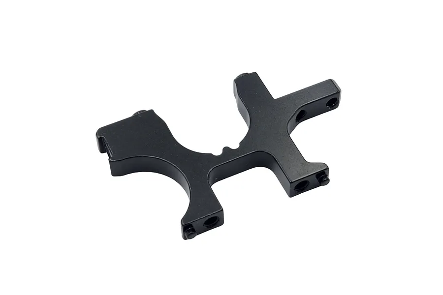 A black anodized aluminium front bulkhead component for an RC car, shown from an angled perspective against a white background.