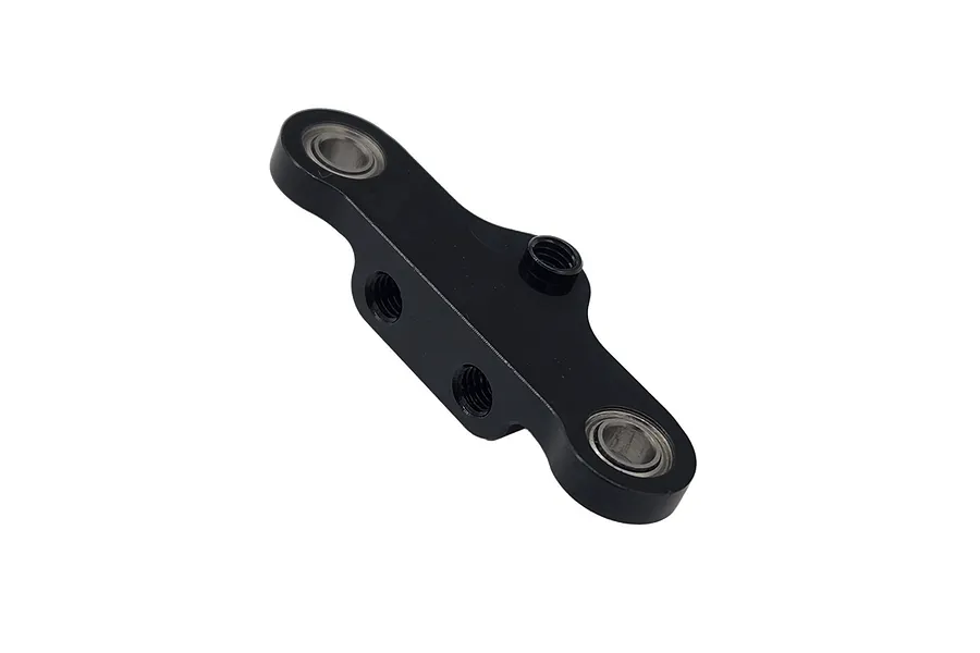 A black anodized aluminium steering rack component for RC cars featuring two ball bearings and three threaded mounting points.