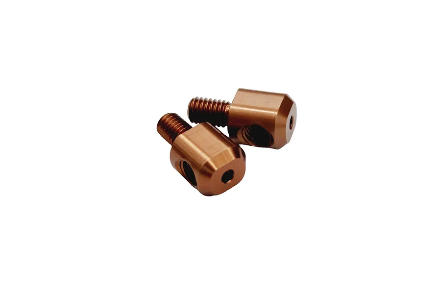 Two copper-coloured metal anti-roll bar adapters for RC cars, featuring threaded studs and cross-drilled holes.