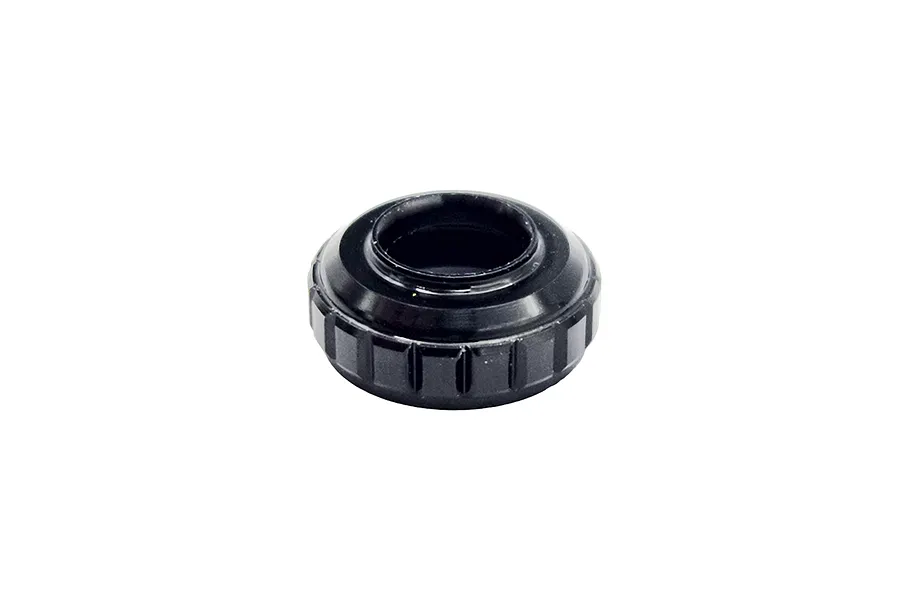 A black anodized metal RC shock bottom cap with a knurled edge, isolated on a white background.