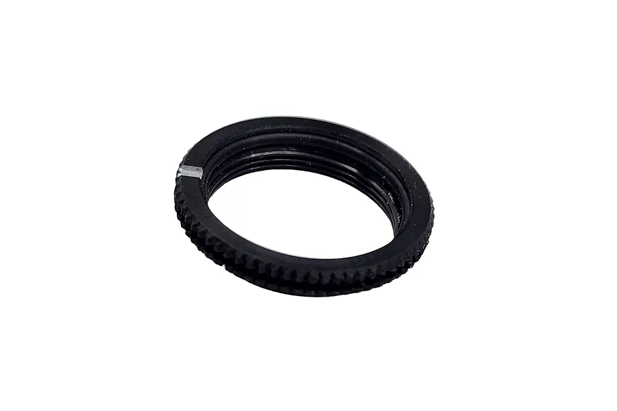 A single black threaded RC shock collar with a knurled outer edge, isolated on a white background.