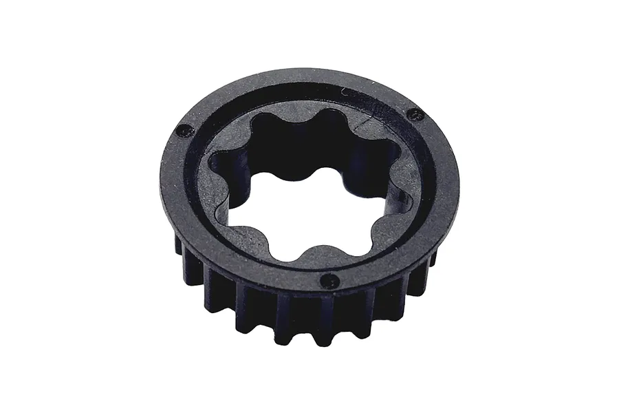 A black plastic RC centre pulley with a star-shaped inner bore and external gear teeth, isolated on a white background.