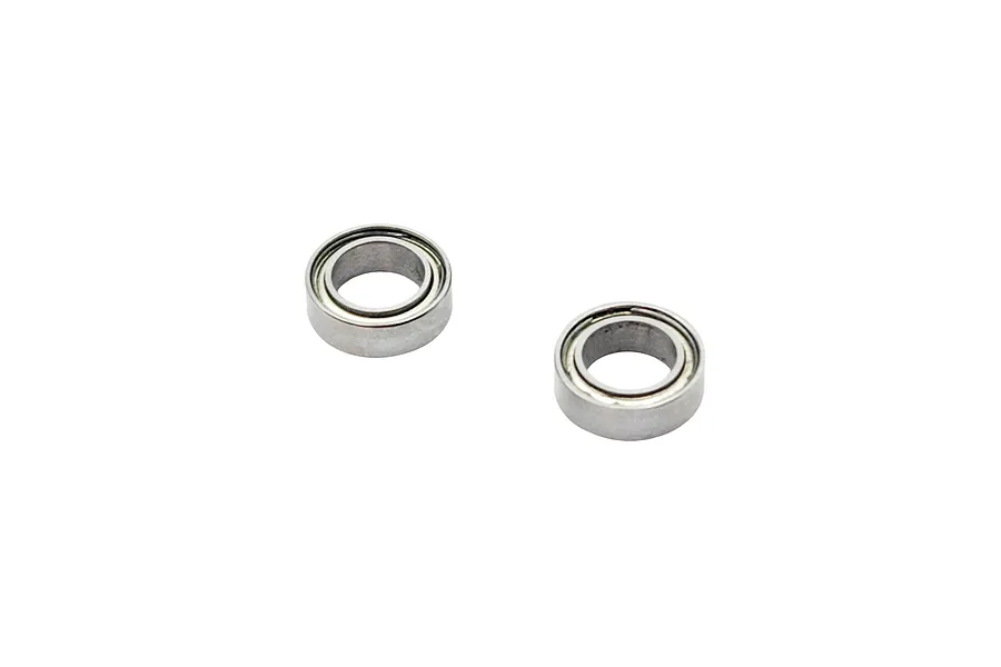 Two small metal shielded ball bearings isolated on a plain white background.