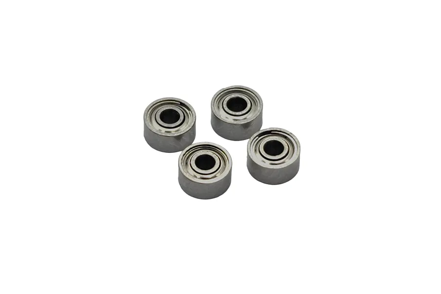 Four small metal shielded ball bearings arranged in a cluster against a white background.