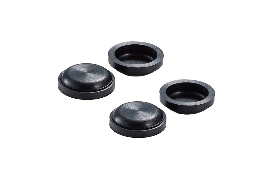 Four black RC shock bladders arranged on a white background, showing both top and bottom sides.