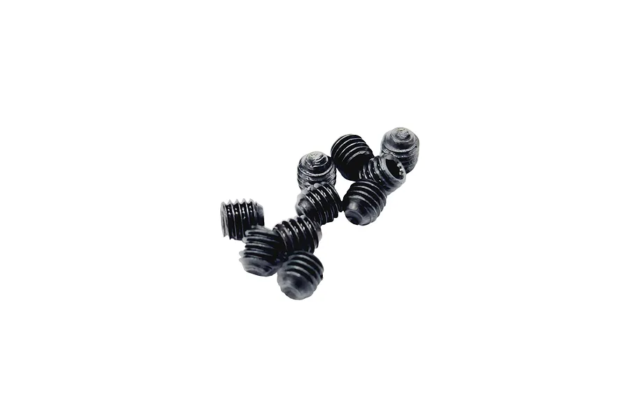A small pile of black metal grub screws with fine threading, isolated on a white background.