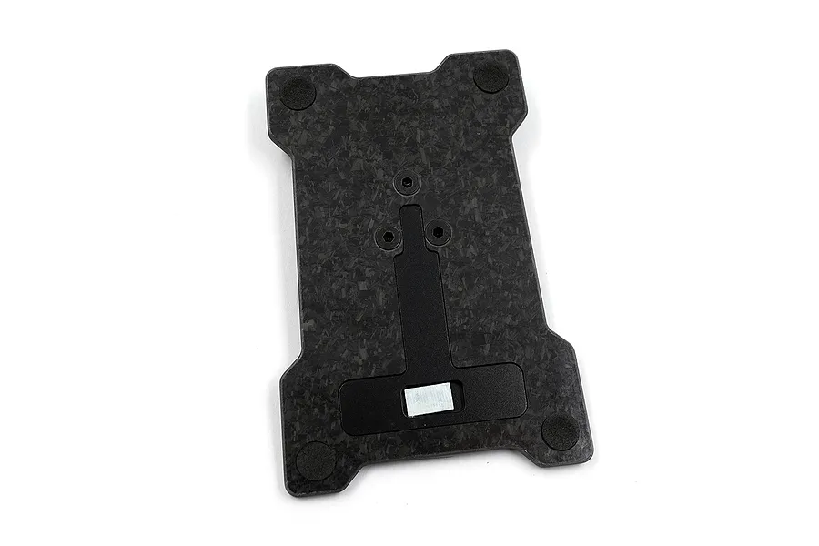 A Yeah Racing carbon fibre base plate for the NB4+ transmitter, featuring a forged carbon pattern, four rubber feet, and a central mounting mechanism.