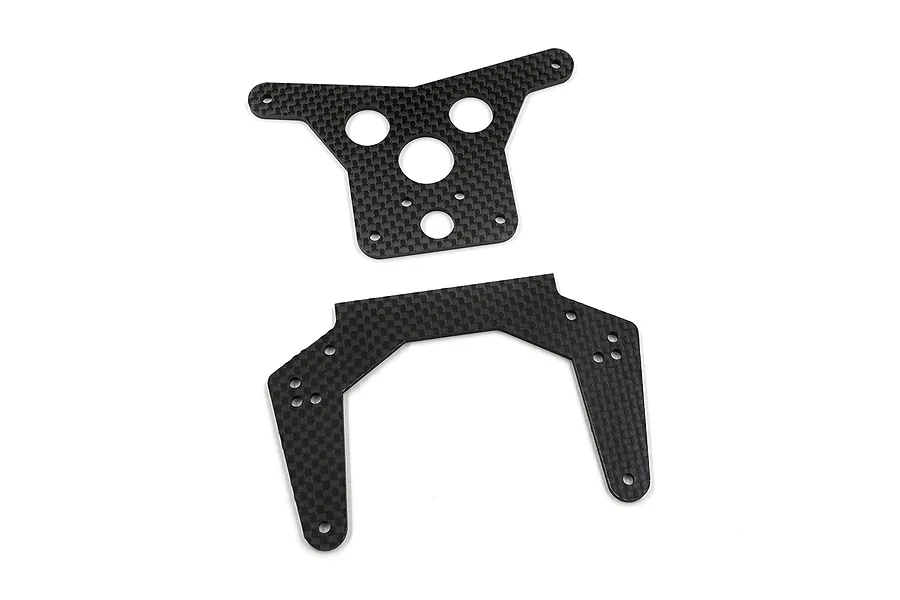 Two carbon fibre RC shock towers with a woven pattern, featuring various mounting holes, displayed against a white background.