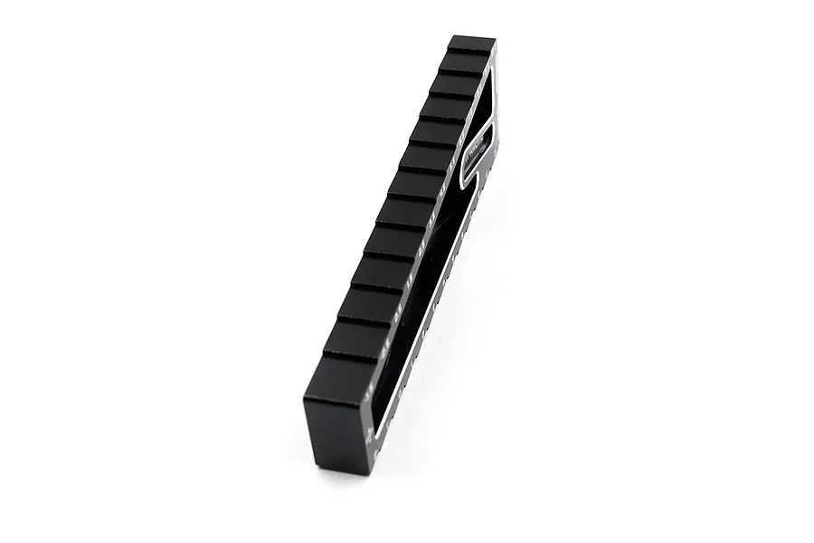 A black anodized aluminum Yeah Racing droop gauge for RC cars, shown at an angle against a white background.