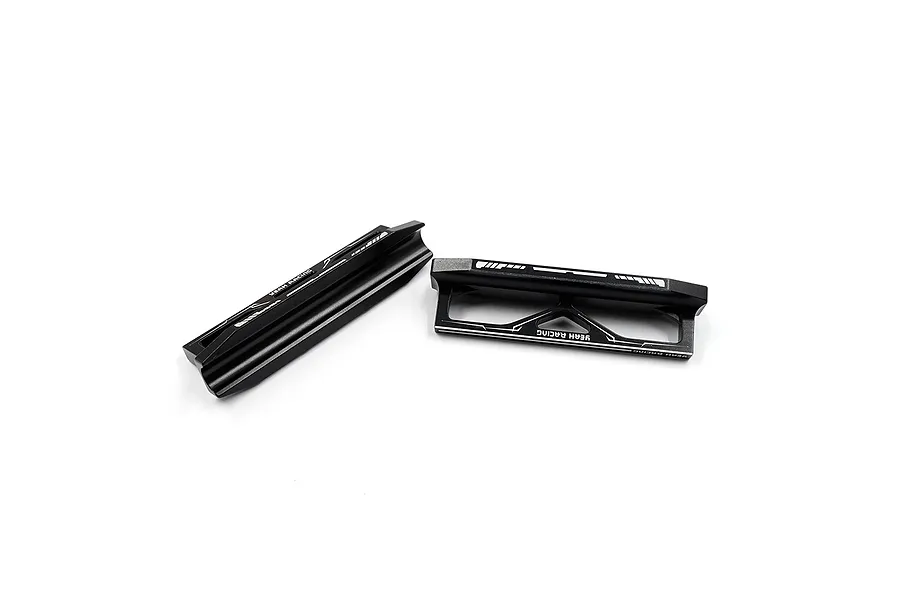 Two black aluminum Yeah Racing droop blocks for 1/8 scale RC cars, shown from different angles on a white background.