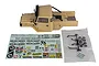 Element RC Enduro Zuul 1/10 scale painted tan body shell with decal sheet and black plastic light bar parts on a white background.