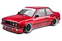 A red MST RMX 2.5 E30RB RC drift car with a Pandem widebody kit, featuring black multi-spoke wheels and detailed decals on a white background.