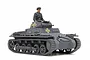 A fully assembled and painted 1/35 scale Tamiya German Panzerkampfwagen I Ausf. B tank model with a crew figure in the turret.