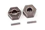 Two Traxxas steel 12mm wheel hex adapters with two matching drive pins on a white background.