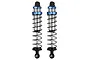 Two Pro-Line Pro-Spec assembled RC shock absorbers with blue anodized collars and black springs against a white background.