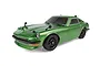 A green Team Associated SR27 Datsun 240Z RC car on a white background, showing a detailed scale model with black wheels and fender mirrors.