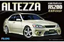 Fujimi 1/24 scale Toyota Altezza RS200 Z Edition plastic model kit box art showing a beige sedan against a black background.