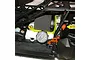 A close-up view of a bright yellow fuel line installed on an HPI Baja RC car engine, connecting the fuel tank to the carburetor.