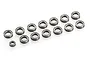 A collection of thirteen metal ball bearings of varying sizes arranged on a white background.