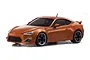 Kyosho Mini-Z Toyota 86 ASC painted body shell in metallic orange, shown from a front three-quarter angle against a white background.