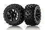 Two black RC car wheels with knobby off-road tires and 10-spoke rims, shown against a white background.