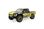 Losi Tenacity TT Pro 4X4 RC Short Course Truck in Brenthel Edition livery, featuring black and yellow paint with sponsor decals on a white background.