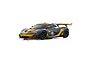 A studio shot of a Kyosho Mini-Z McLaren P1 GTR RC car in grey and yellow livery, featuring 60th anniversary branding on a white background.