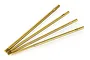 Four gold-colored metal hex driver replacement tips arranged in a fan shape on a white background.