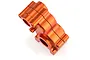 An orange anodized aluminium gearbox case for an RC car, shown from a high angle against a white background.