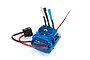 Traxxas Velineon VXL-4s electronic speed controller with blue casing, integrated cooling fan, and pre-soldered motor and battery connectors.