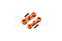 Two orange anodized aluminium steering assembly mounts with two flat-head screws on a white background.