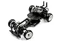Onisiki Kodama 1/24-1/28 scale RWD RC drift car roller chassis featuring a carbon fiber frame and white wheels on a white background.