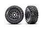 Two Traxxas Maxx SC belted RC tyres mounted on black rims, shown from front and angled views against a white background.